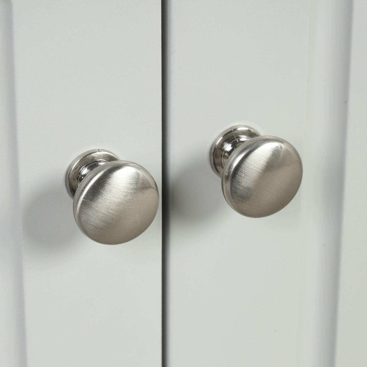 Triangle bathroom storage cabinet door; white linen cabinet with two brushed metal knobs on Tampa Home & Garden Store