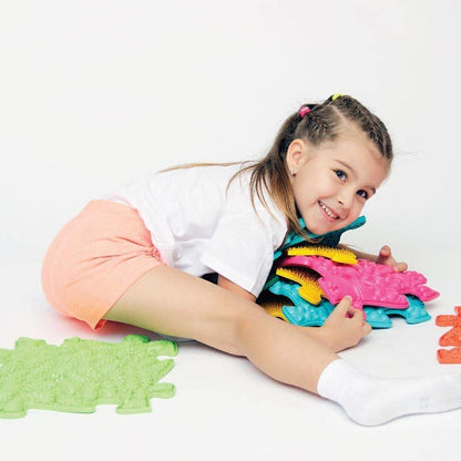 Medium 1 Sensory Playmat Set by TINNITOTS; foam tiles green pink blue with a child playing on Tampa Home & Garden Store