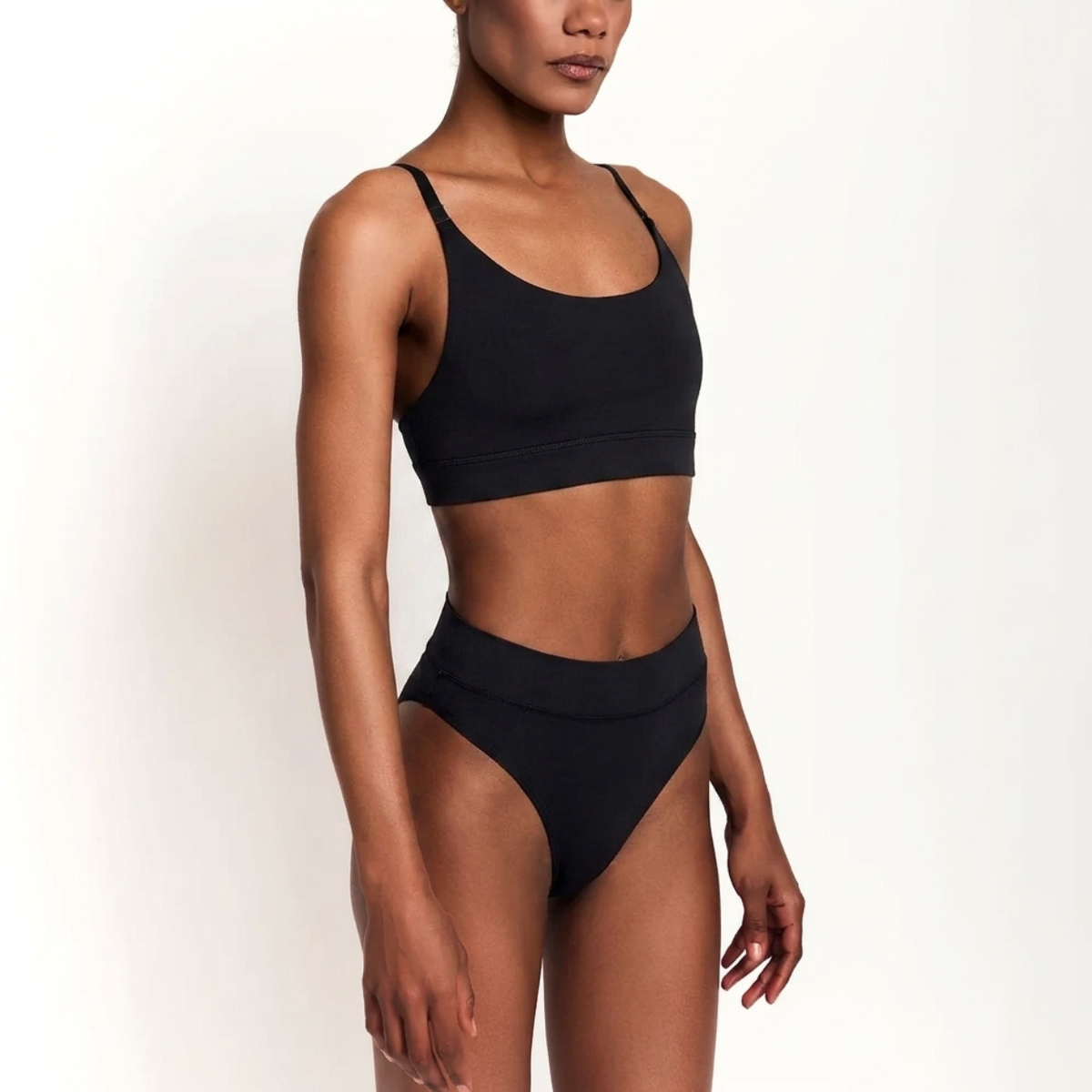 Scoop bralette and matching black organic cotton briefs two-piece set on model on Tampa Home & Garden Store