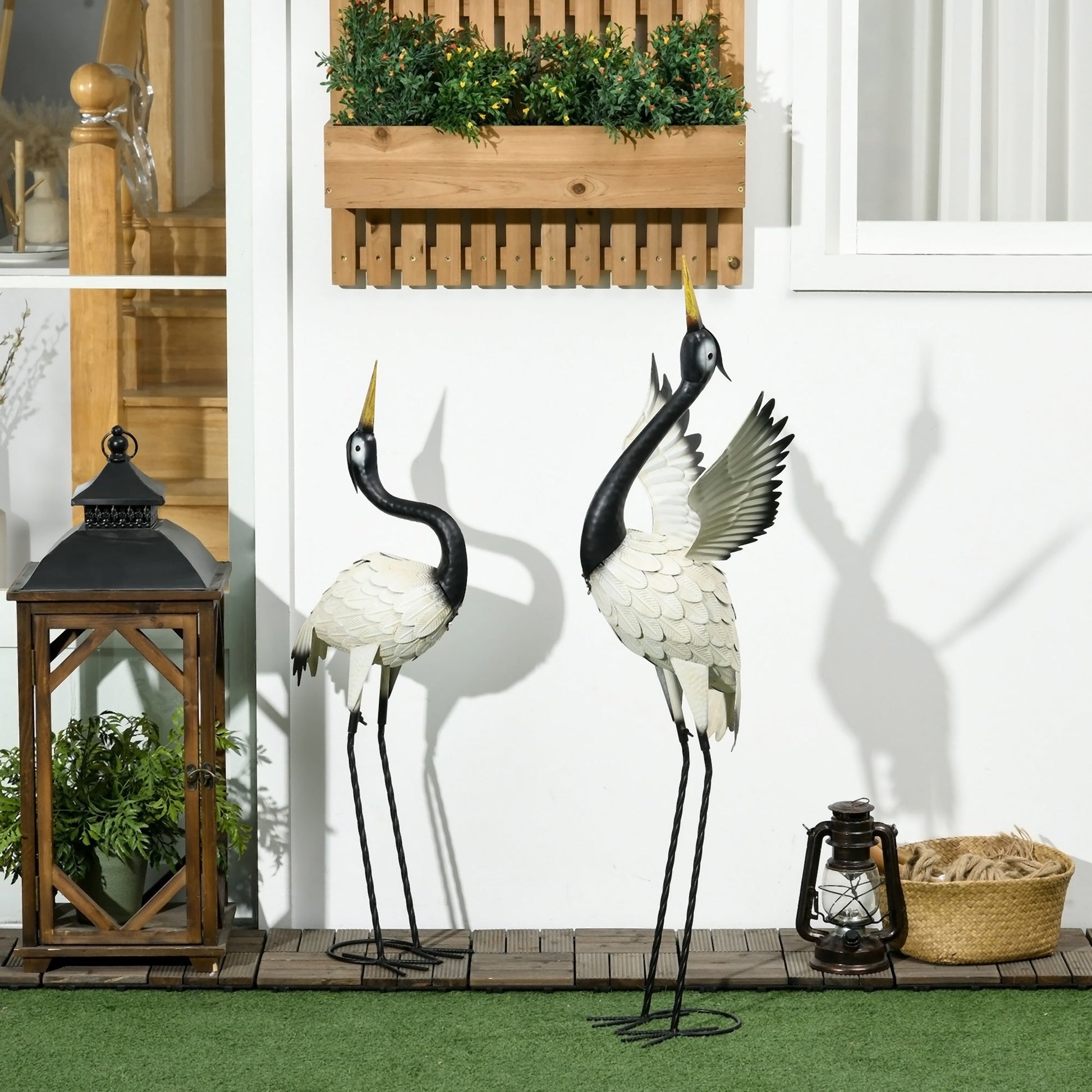 Outsunny Heron Garden Statues Set of 2 metal cranes with black legs and white bodies on Tampa Home & Garden Store
