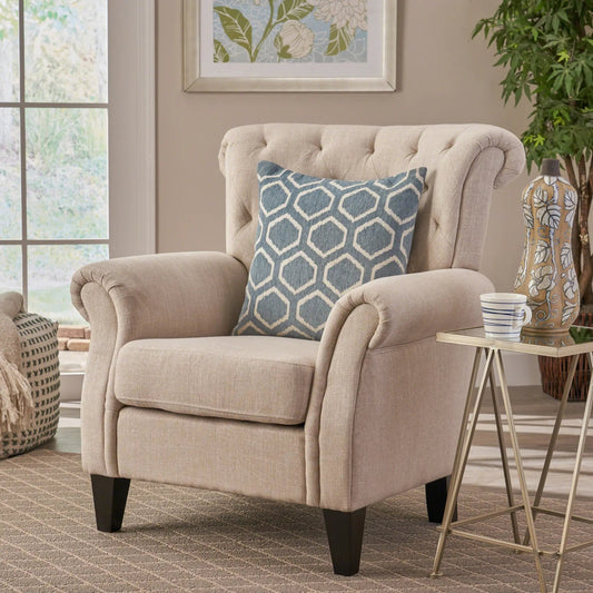 Springfield Tufted Armchair in beige fabric with dark wood legs and blue geometric pillow on Tampa Home & Garden Store