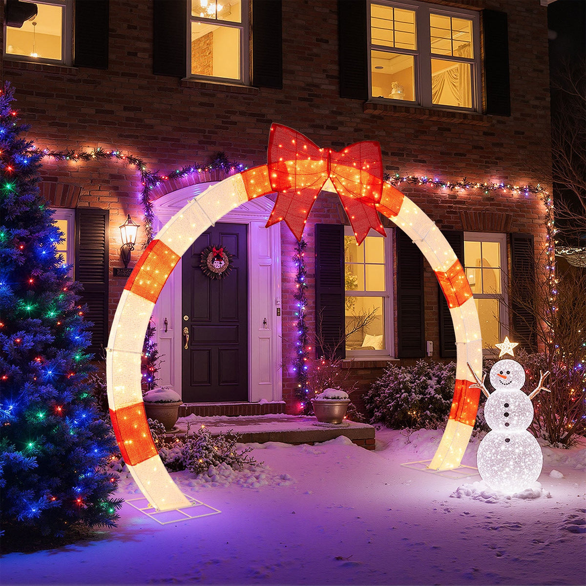 10.4 ft Christmas Archway with Red Bow and LED Lights by DirectDeals in snowy yard on Tampa Home & Garden Store