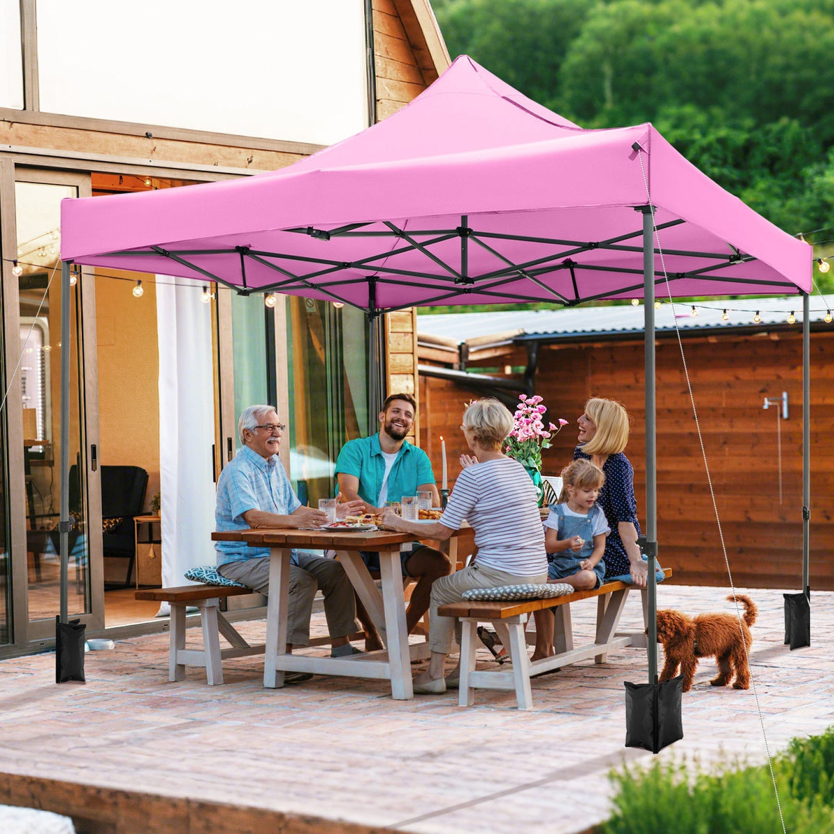 GemGear 10x10 ft pink outdoor pop up canopy tent with black steel frame at a backyard gathering on Tampa Home & Garden Store