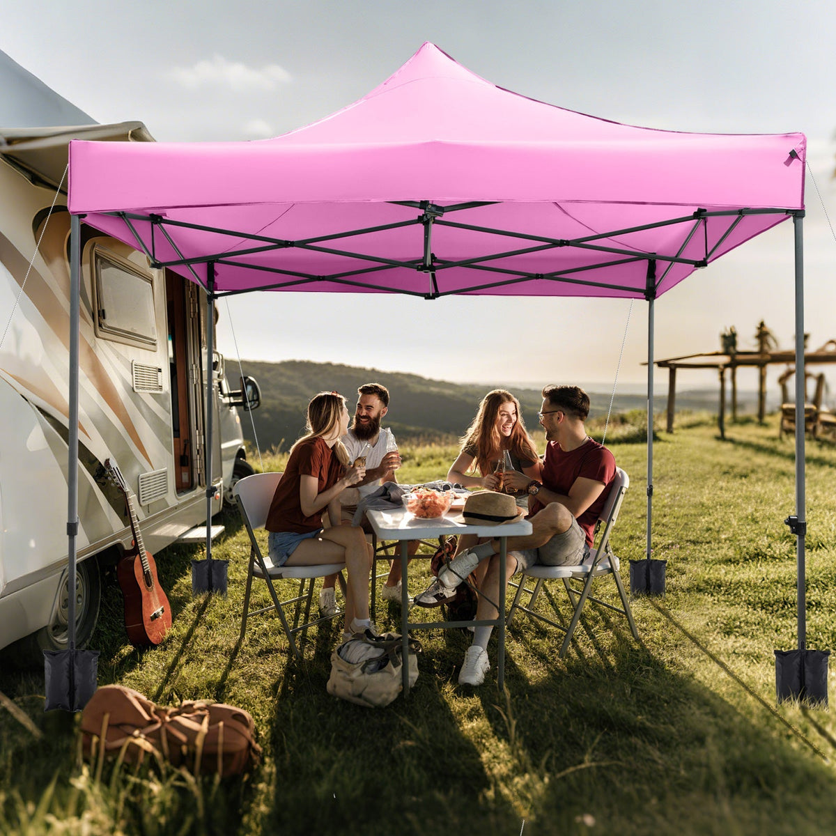 GemGear 10x10 ft pink outdoor pop-up canopy tent with wheeled bag beside a motorhome on Tampa Home & Garden Store