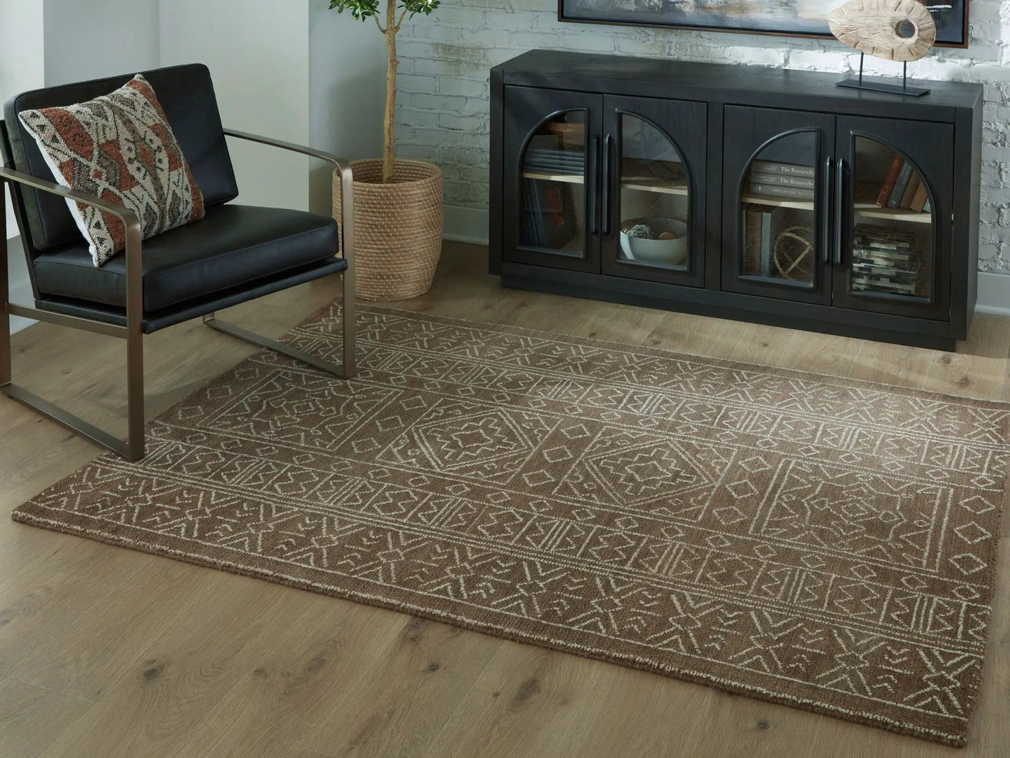 Merrittman rug by Unique Piece Furniture, brown geometric area rug in living room setting on Tampa Home & Garden Store