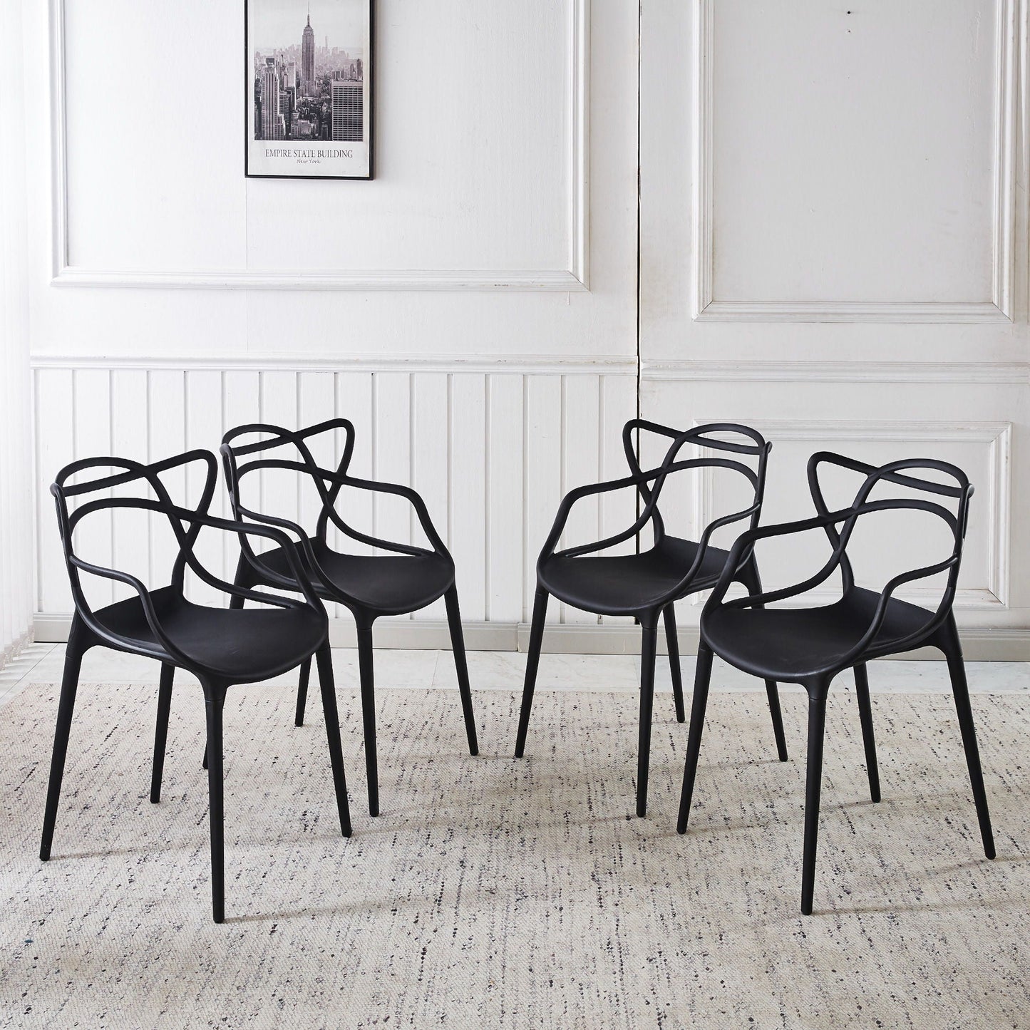 Dining chair set of 4 black plastic seats with curved wire-frame backs on Tampa Home & Garden Store