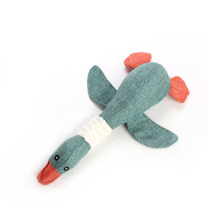 Plush Dayan sounding dog toy in teal with orange fins on Tampa Home & Garden Store