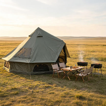 GemGear Oxford Bell Tent 13.1ft with stove jack in grassy campsite with table and seating on Tampa Home & Garden Store