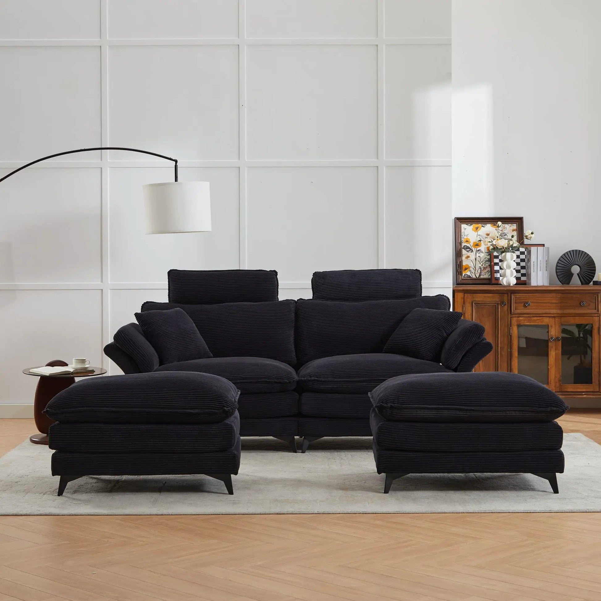 Modern deep-seat sectional sofa with ottoman in black fabric for a contemporary living room on Tampa Home & Garden Store