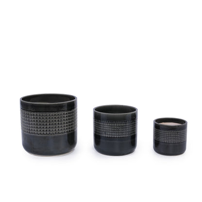 Handmade garden pots in black ceramic with grid-textured midsection and varying heights on Tampa Home & Garden Store