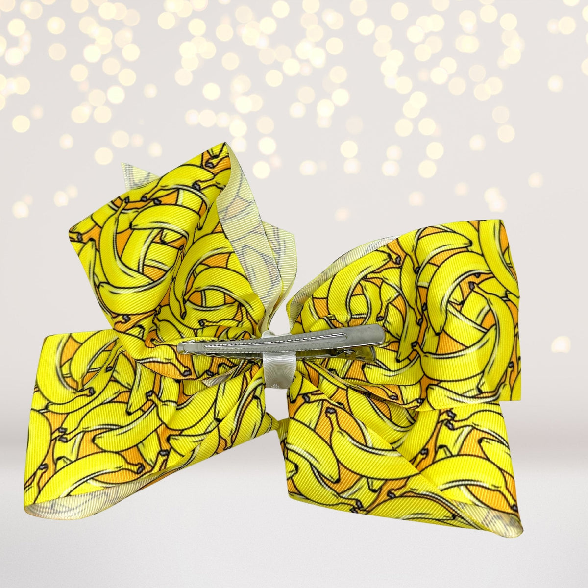 Fun Fruit Hair Bows, oversized 8-inch yellow fruit-print bows with silver clips pair on Tampa Home & Garden Store