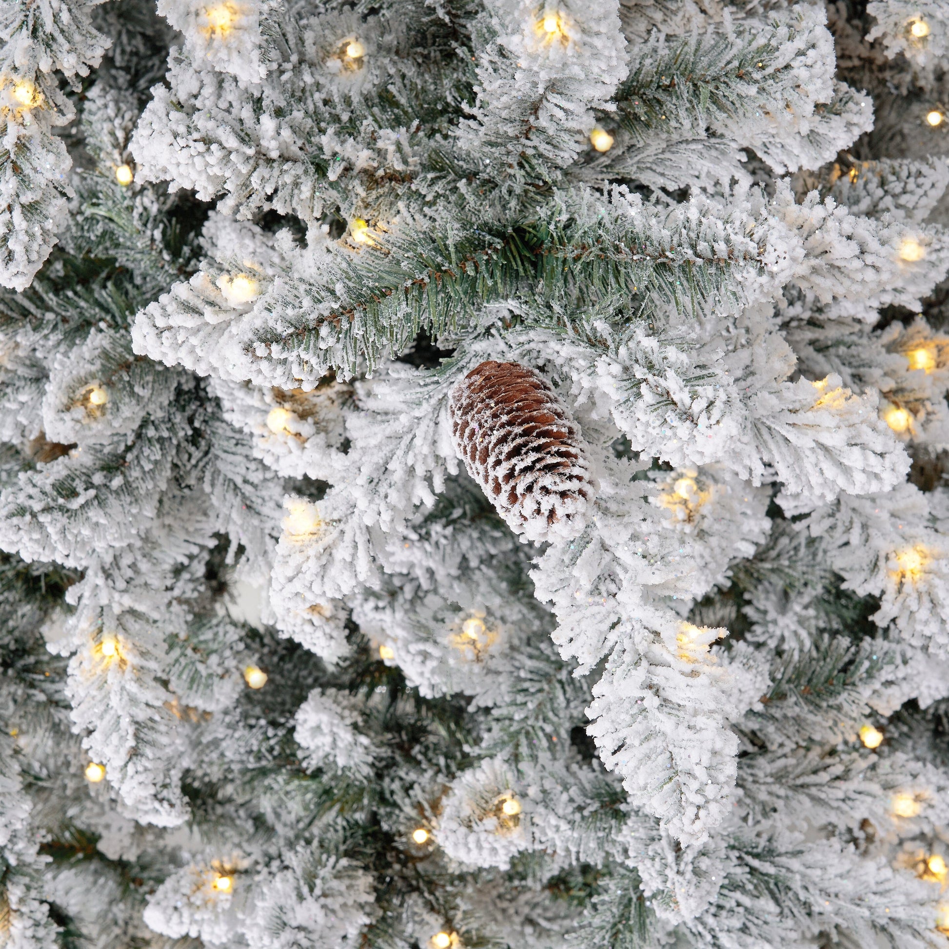 11’ Flocked Livingston Fir Artificial Christmas Tree with Pine Cones, 950 Clear Warm LED Lights and 3016 Bendable Branches - Tampa Home & Garden Store