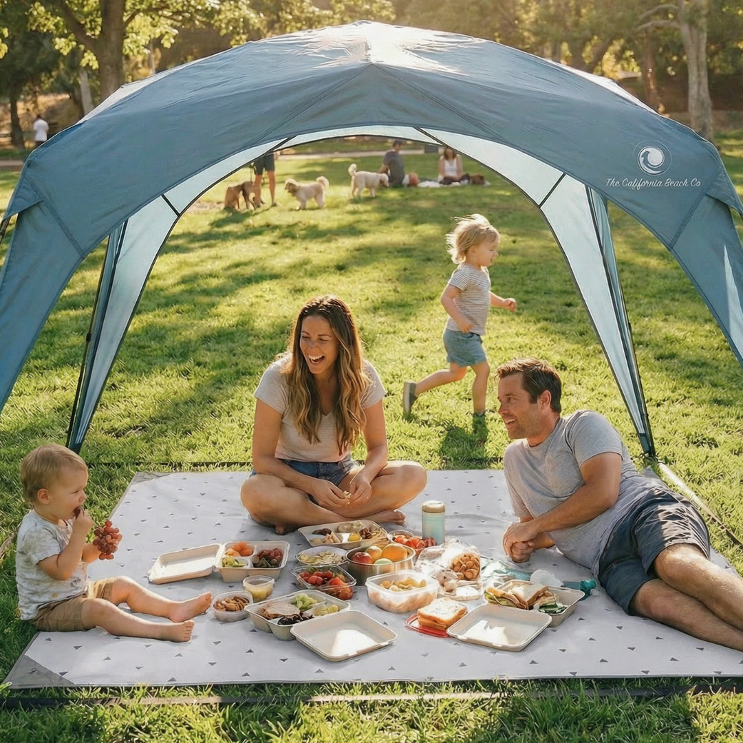 Pop 'N Go Canopy by The California Beach Company LLC, family picnic under canopy on lawn on Tampa Home & Garden Store