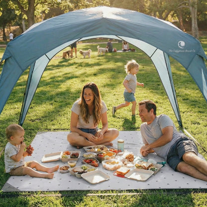 Pop 'N Go Canopy by The California Beach Company LLC, family picnic under canopy on lawn on Tampa Home & Garden Store
