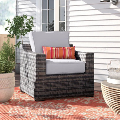 Patio chair with cushions, modern wicker arm chair in gray with orange striped pillow on Tampa Home & Garden Store