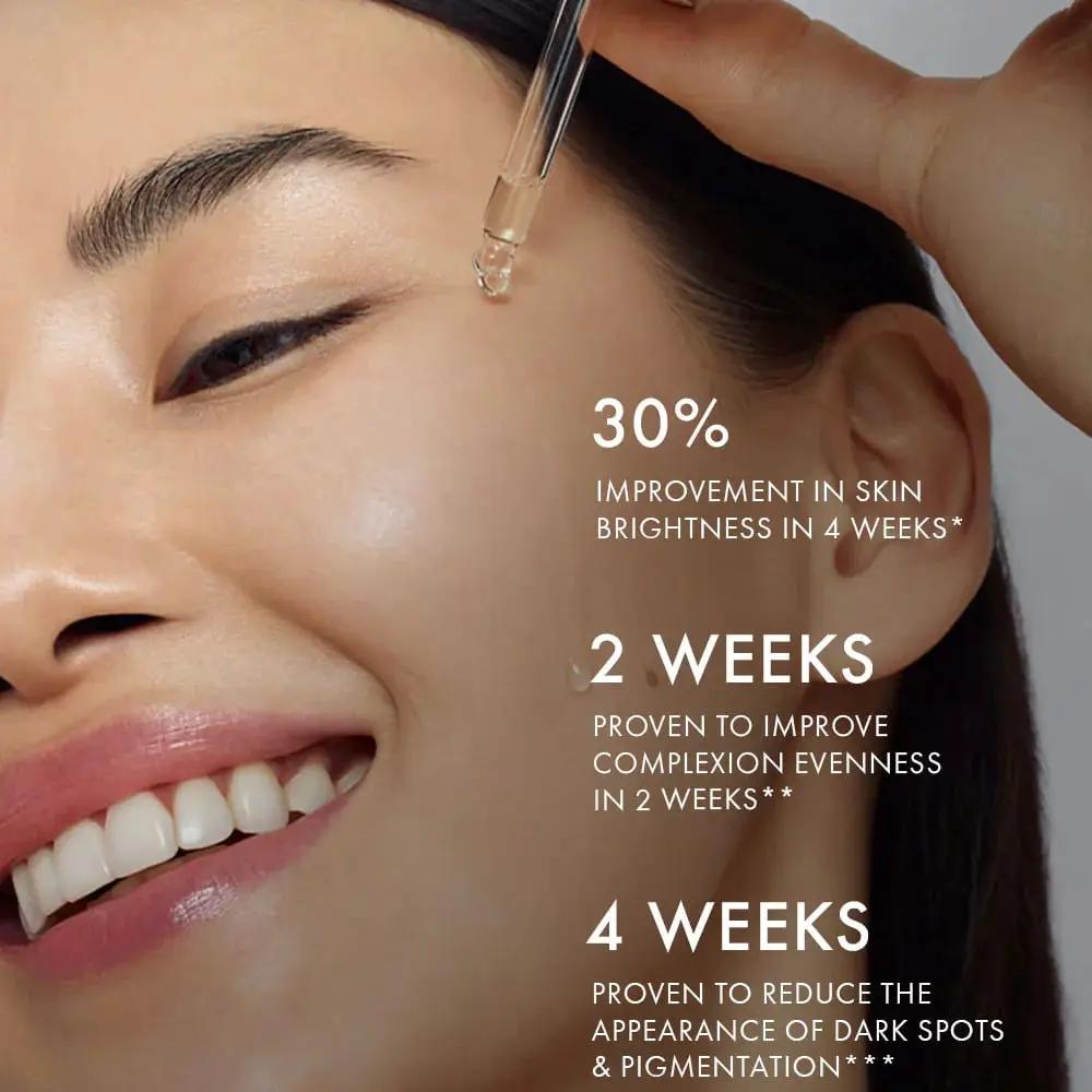 111SKIN Black Diamond Vitamin C Brightening Booster serum dropper applied to cheek, radiant skin on Tampa Home & Garden Store
