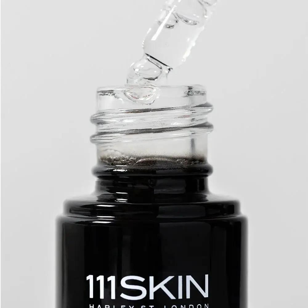 111SKIN Black Diamond Vitamin C Brightening Booster serum in a black bottle with dropper on Tampa Home & Garden Store