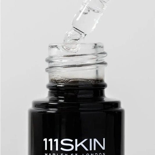 111SKIN Black Diamond Vitamin C Brightening Booster serum in a black bottle with dropper on Tampa Home & Garden Store