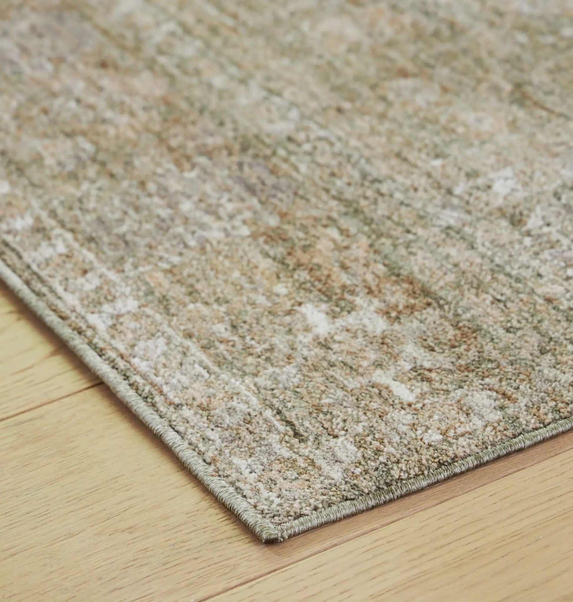 Neroham rug, area rug by Unique Piece Furniture in beige speckled tones with a light edge on Tampa Home & Garden Store