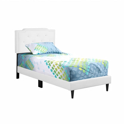 Button tufted upholstered bed with white headboard and colorful bedding on Tampa Home & Garden Store