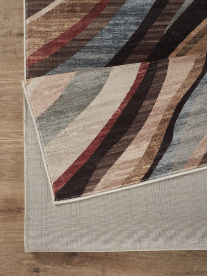 Modern polyester rug by HouseOfZazla with diagonal beige, brown, red and blue stripes on wood floor on Tampa Home & Garden Store