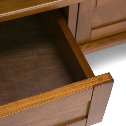 Warm Shaker transitional TV stand closeup in warm brown wood with angled leg supports on Tampa Home & Garden Store