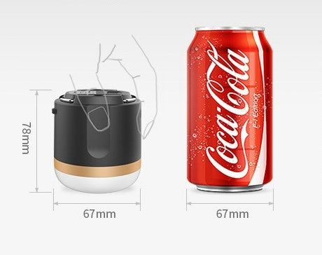 Outdoor tent camping handheld lantern black with beige base beside cola can for scale on Tampa Home & Garden Store