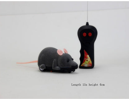Remote control toy mouse with pink ears and gray body beside black controller Sell My Stuff on Tampa Home & Garden Store