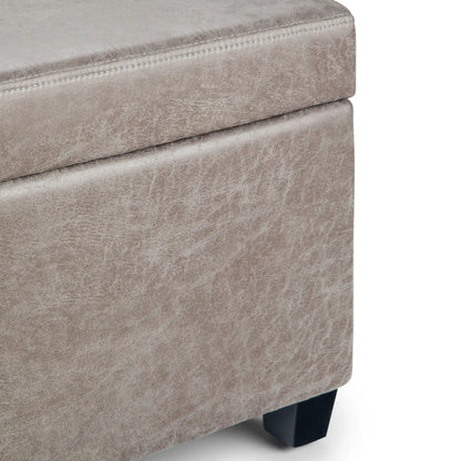 Avalon storage ottoman bench in beige distressed fabric with a stitched seam and black legs on Tampa Home & Garden Store