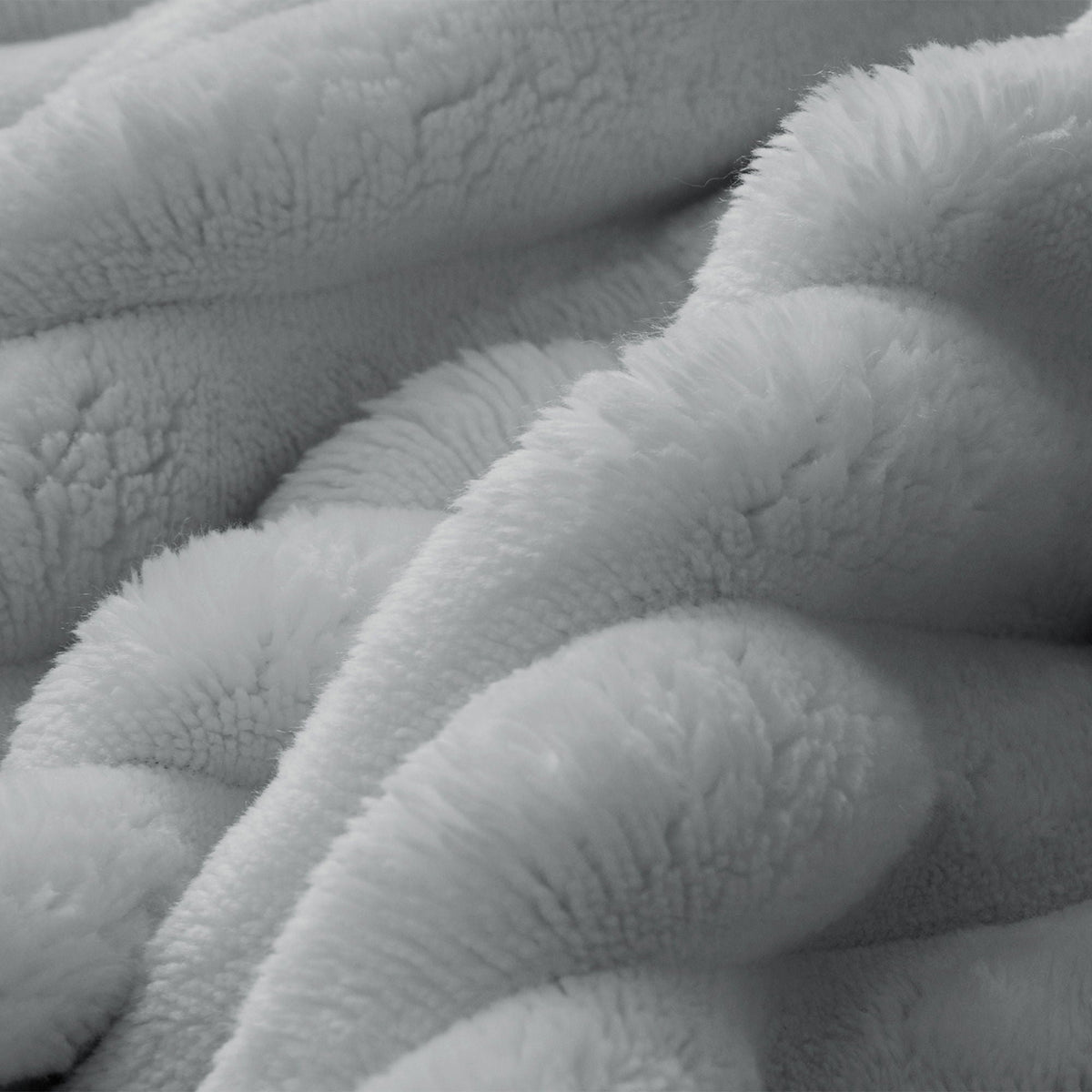 Faux fur fabric close-up in white with plush, fluffy texture on Tampa Home & Garden Store