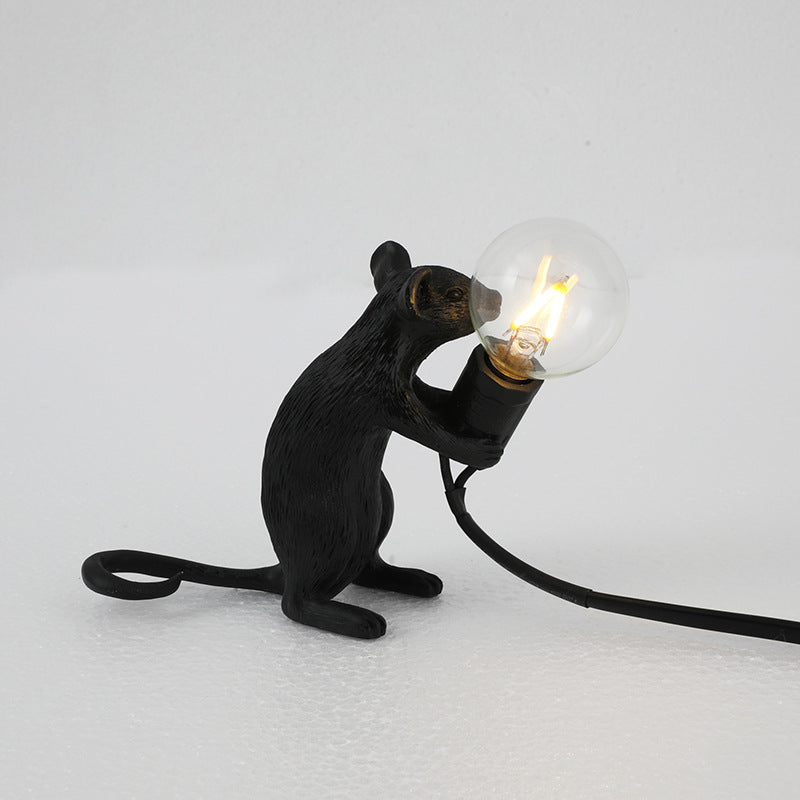 Stevvex resin mouse table lamp black mini rat figure holding a glowing LED bulb with cord on Tampa Home & Garden Store