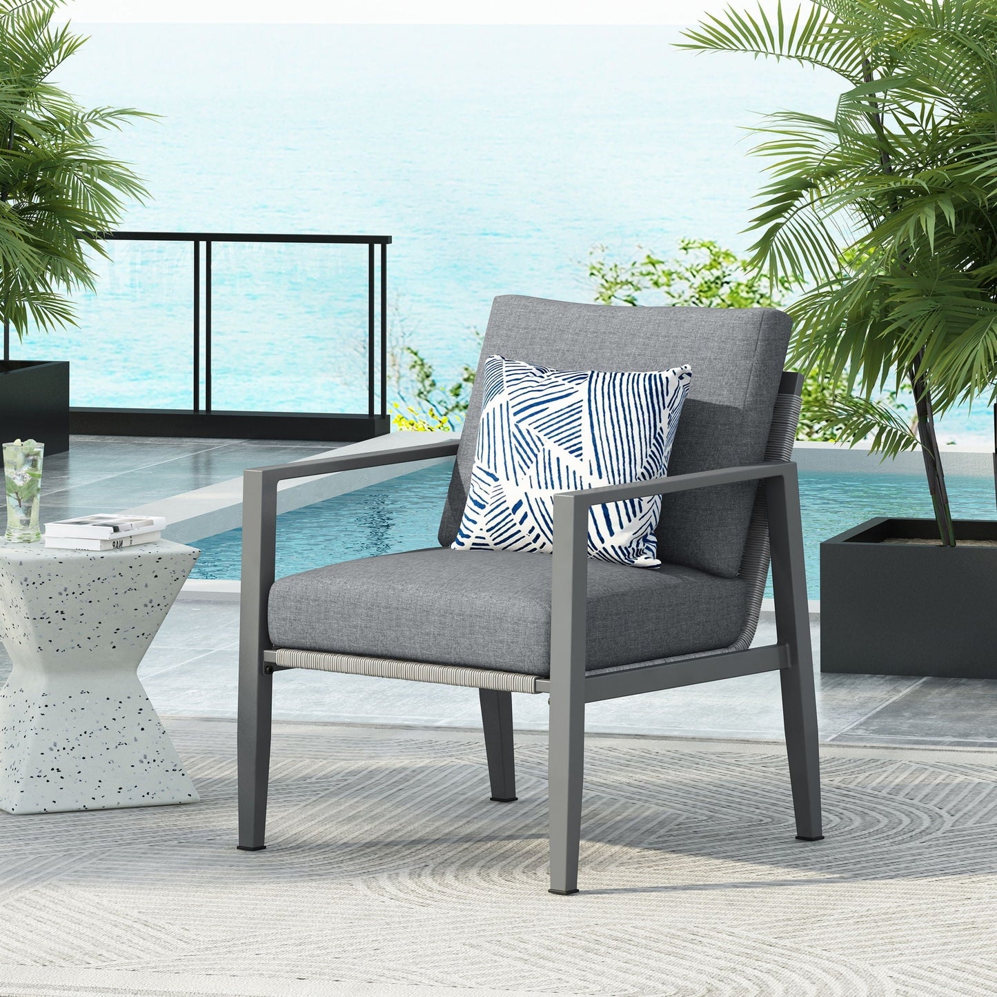 Modern lounge chair with gray fabric cushions and rope accents, metal frame outdoor club chair on Tampa Home & Garden Store