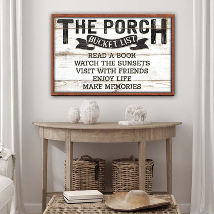 The Porch Bucket Sign canvas with whitewashed wood background and black lettering in a wood frame on Tampa Home & Garden Store