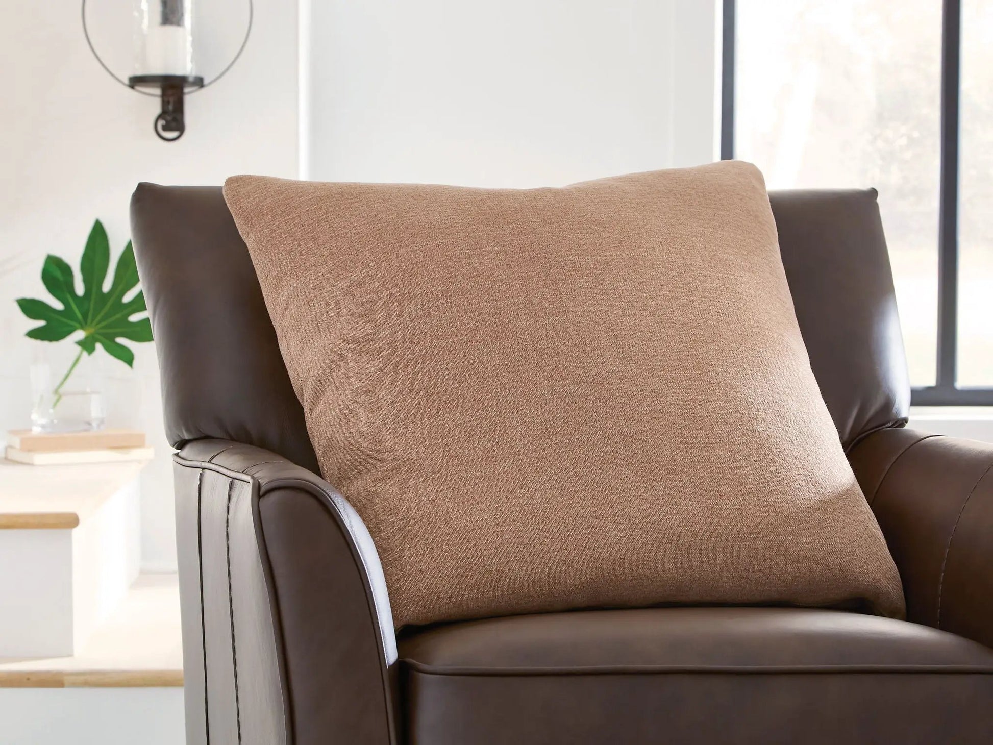 Brockbert - Pillow beige textured fabric on brown leather chair on Tampa Home & Garden Store