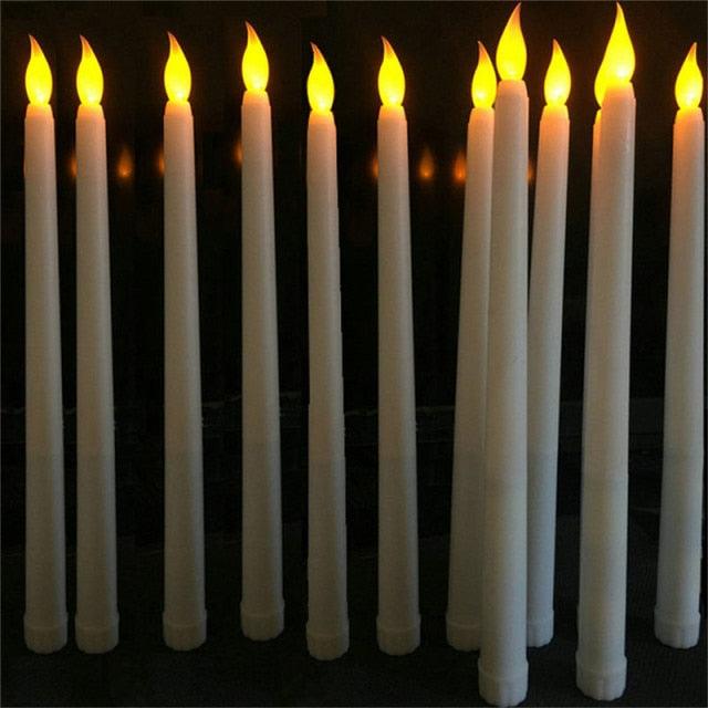 12 white taper candles with warm flickering flames for Christmas, home and wedding decor on Tampa Home & Garden Store