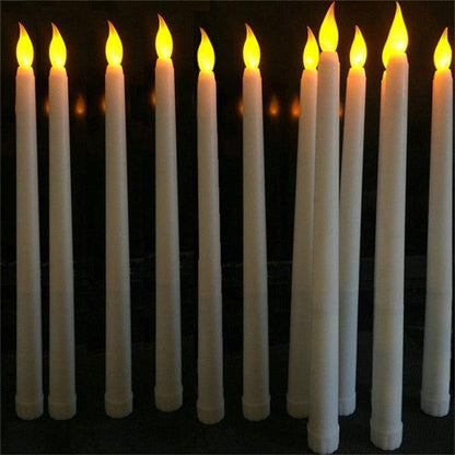 12 white taper candles with warm flickering flames for Christmas, home and wedding decor on Tampa Home & Garden Store