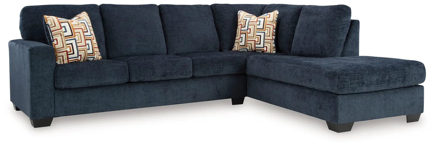 Aviemore sectional sofa navy blue with right chaise and geometric patterned pillows on Tampa Home & Garden Store