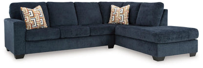 Aviemore sectional sofa navy blue with right chaise and geometric patterned pillows on Tampa Home & Garden Store