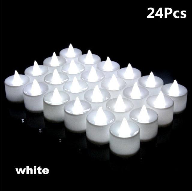 Stevvex white flameless LED tea lights, 24 pcs flicker candlelike candles on black surface on Tampa Home & Garden Store