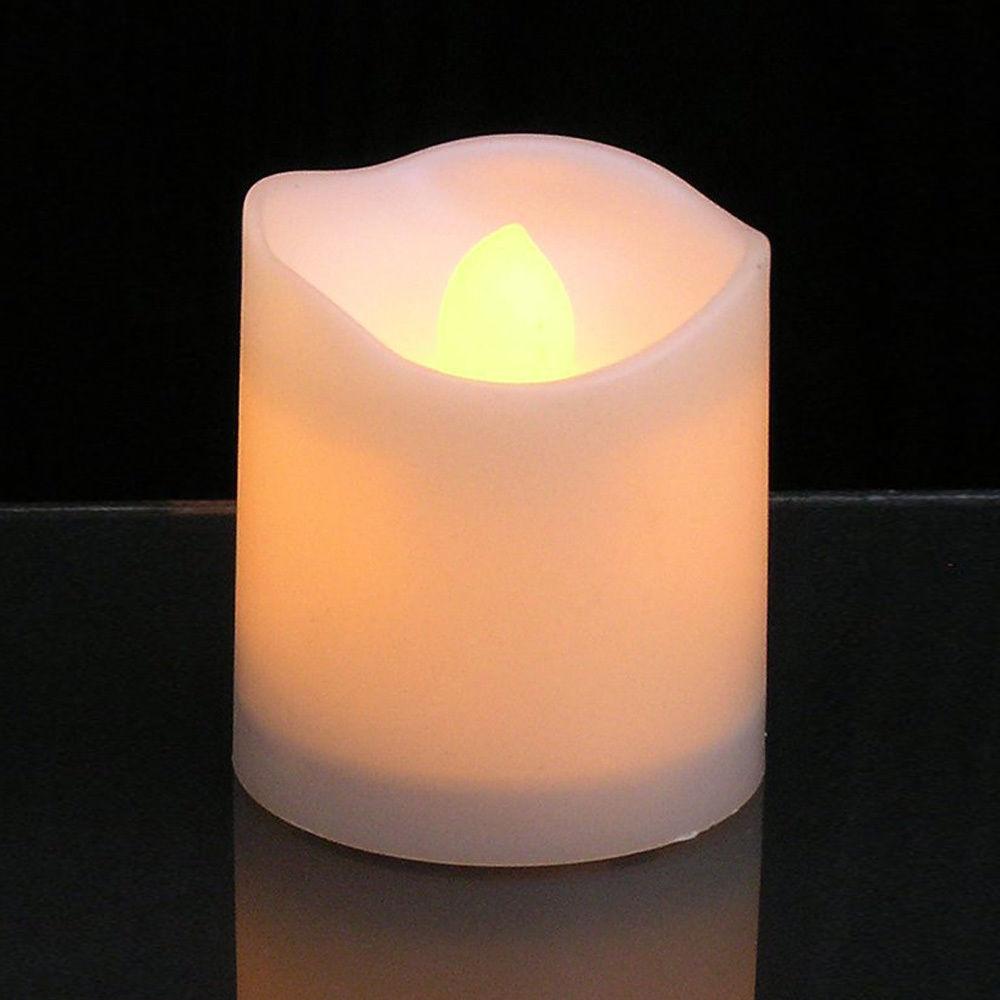 Flameless LED tea light candle white wax shell with warm flicker battery powered on Tampa Home & Garden Store