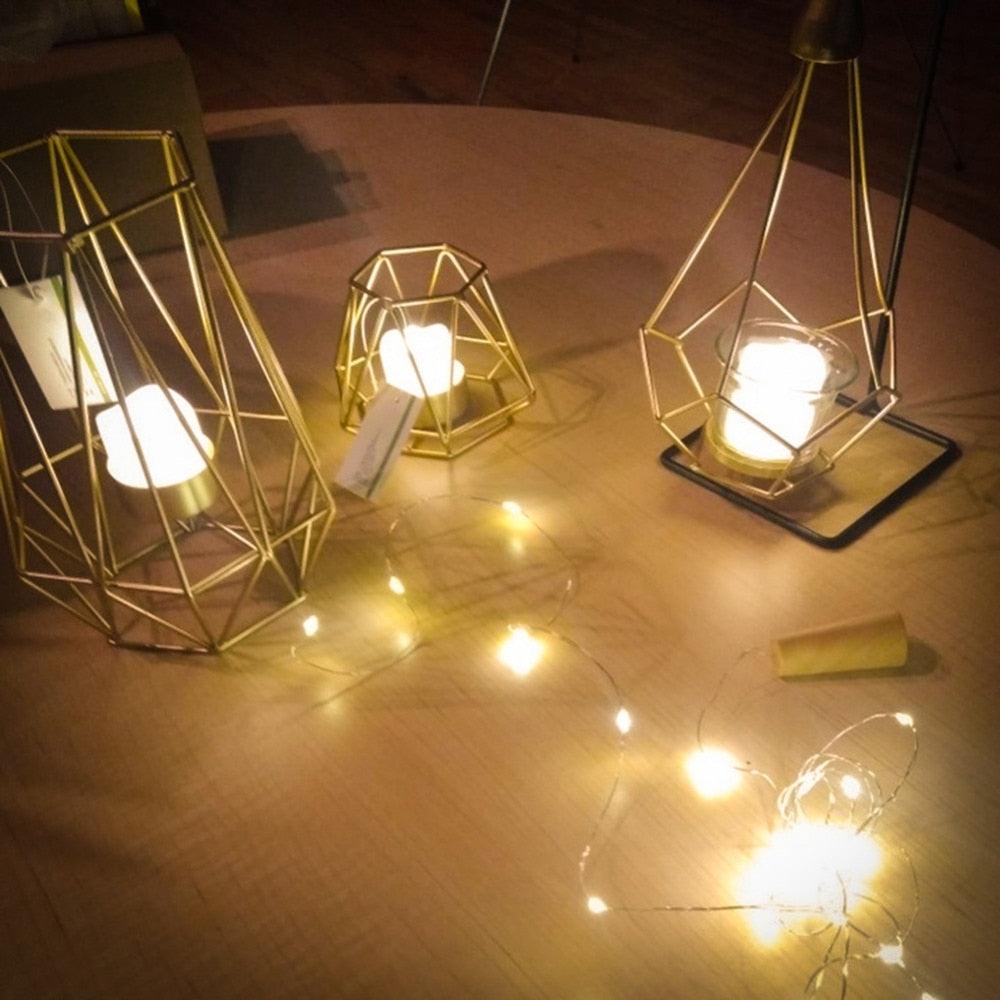 Stevvex flameless LED tea lights in three gold geometric lanterns with warm glow on Tampa Home & Garden Store