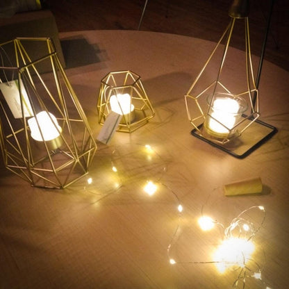 Stevvex flameless LED tea lights in three gold geometric lanterns with warm glow on Tampa Home & Garden Store