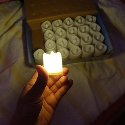 Stevvex flameless LED tea light set with warm white glow held in hand beside a box of candles on Tampa Home & Garden Store