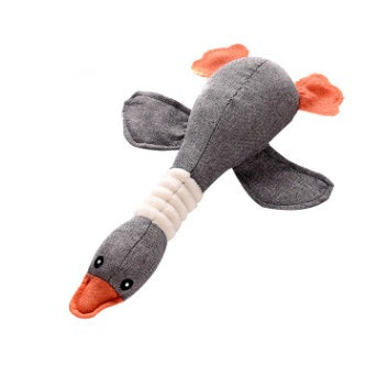 Dayan plush dog toy in gray with orange beak and tail fins, beige ribbed neck on Tampa Home & Garden Store