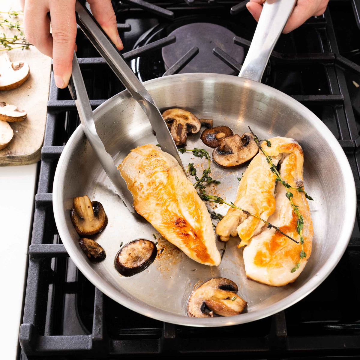 5-Ply Stainless Cookware Set, 14-Piece by Alva on stove cooking chicken and mushrooms on Tampa Home & Garden Store