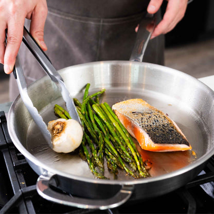 5-Ply Stainless Cookware Set, 14-Piece in stainless pan with asparagus and salmon on Tampa Home & Garden Store