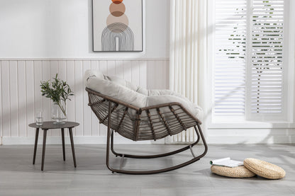 Outdoor rattan rocking chair with padded gray cushion, dark brown wicker frame on Tampa Home & Garden Store