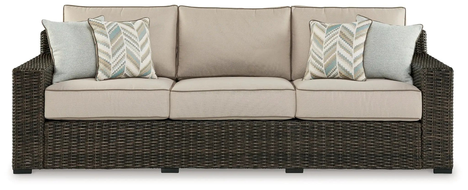 Coastline Bay sofa with beige cushions, dark wicker frame and blue chevron pillows on Tampa Home & Garden Store
