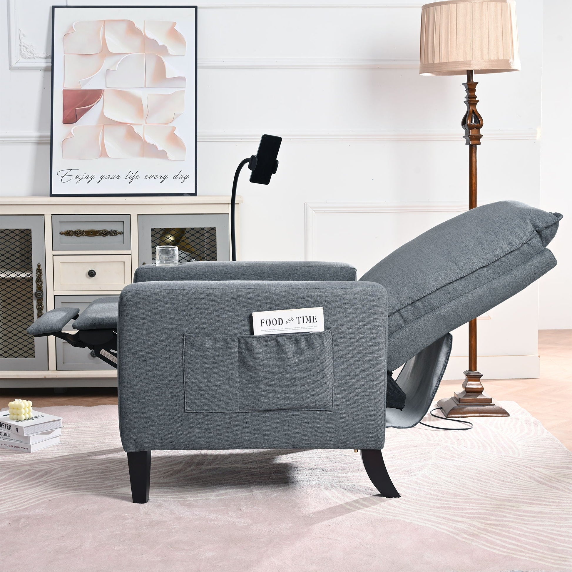 Gray fabric recliner chair by HouseOfZazla with built-in magazine pocket in living room on Tampa Home & Garden Store