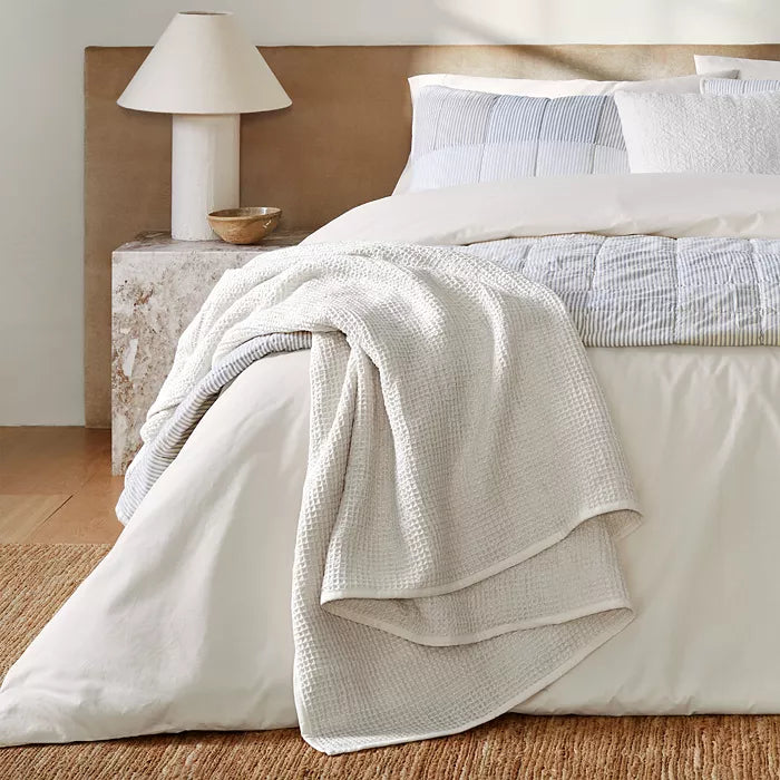 Nate Home by Nate Berkus waffle blanket, queen size, white waffle-knit draped over bed on Tampa Home & Garden Store